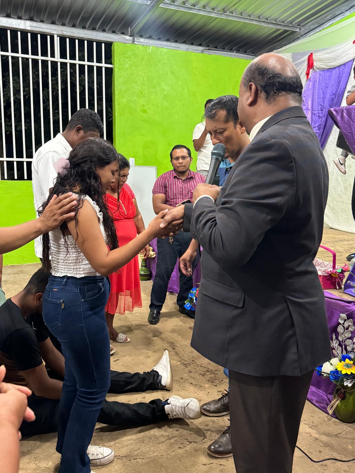 Prayer for a young woman during a service in Nicaragua