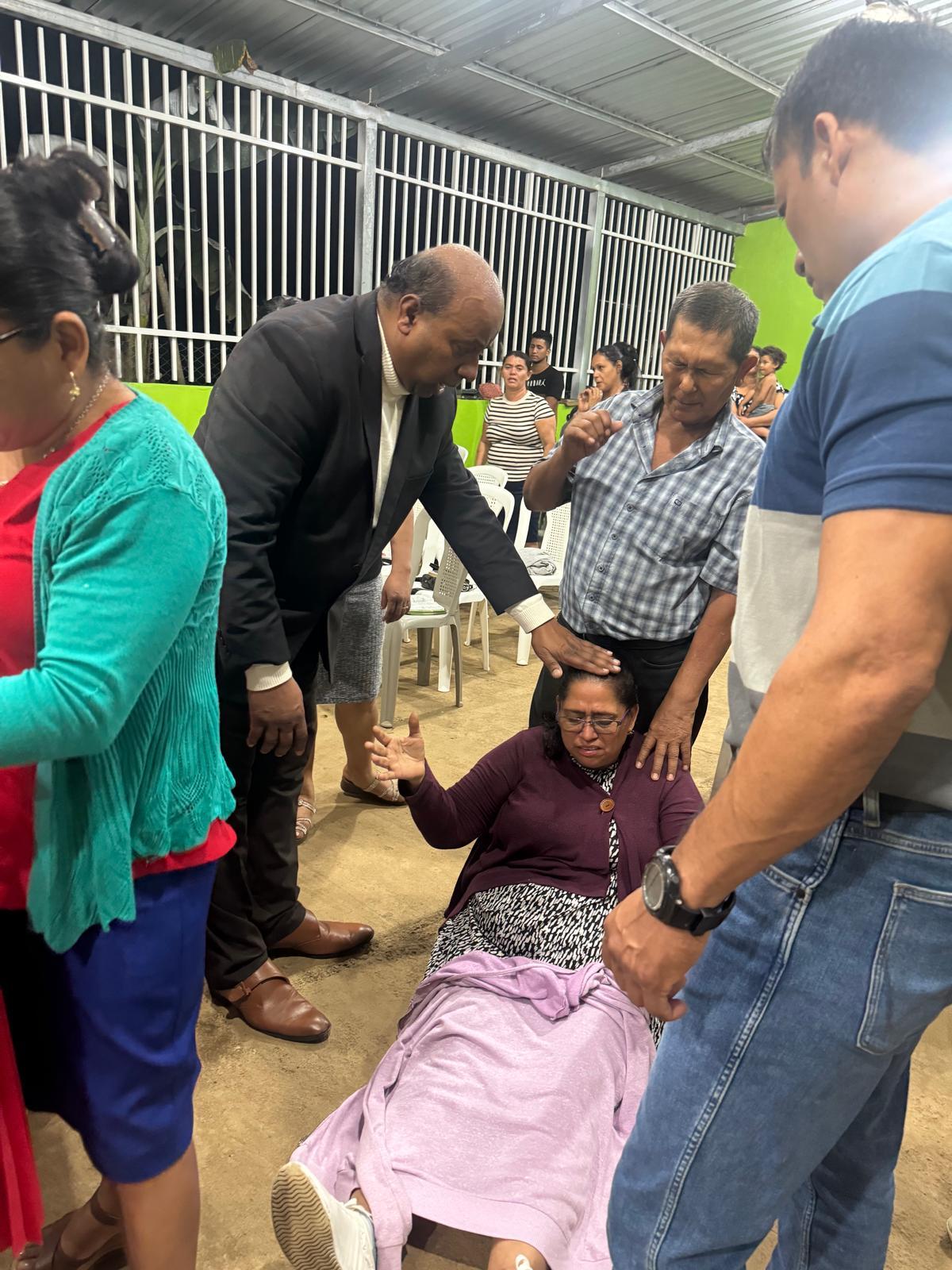 Praying for a woman in Nicaragua