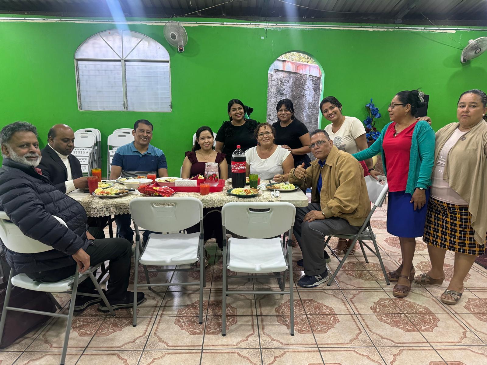 Sharing a meal with church members in Nicaragua